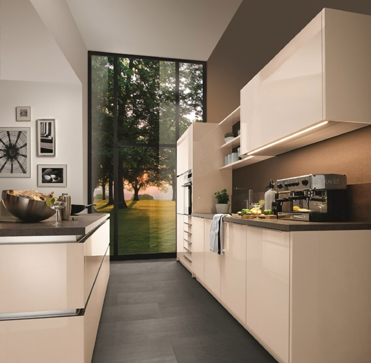 Beige modern German kitchen customized for a client’s lifestyle at a kitchen design showroom in Toronto, Ontario, Canada